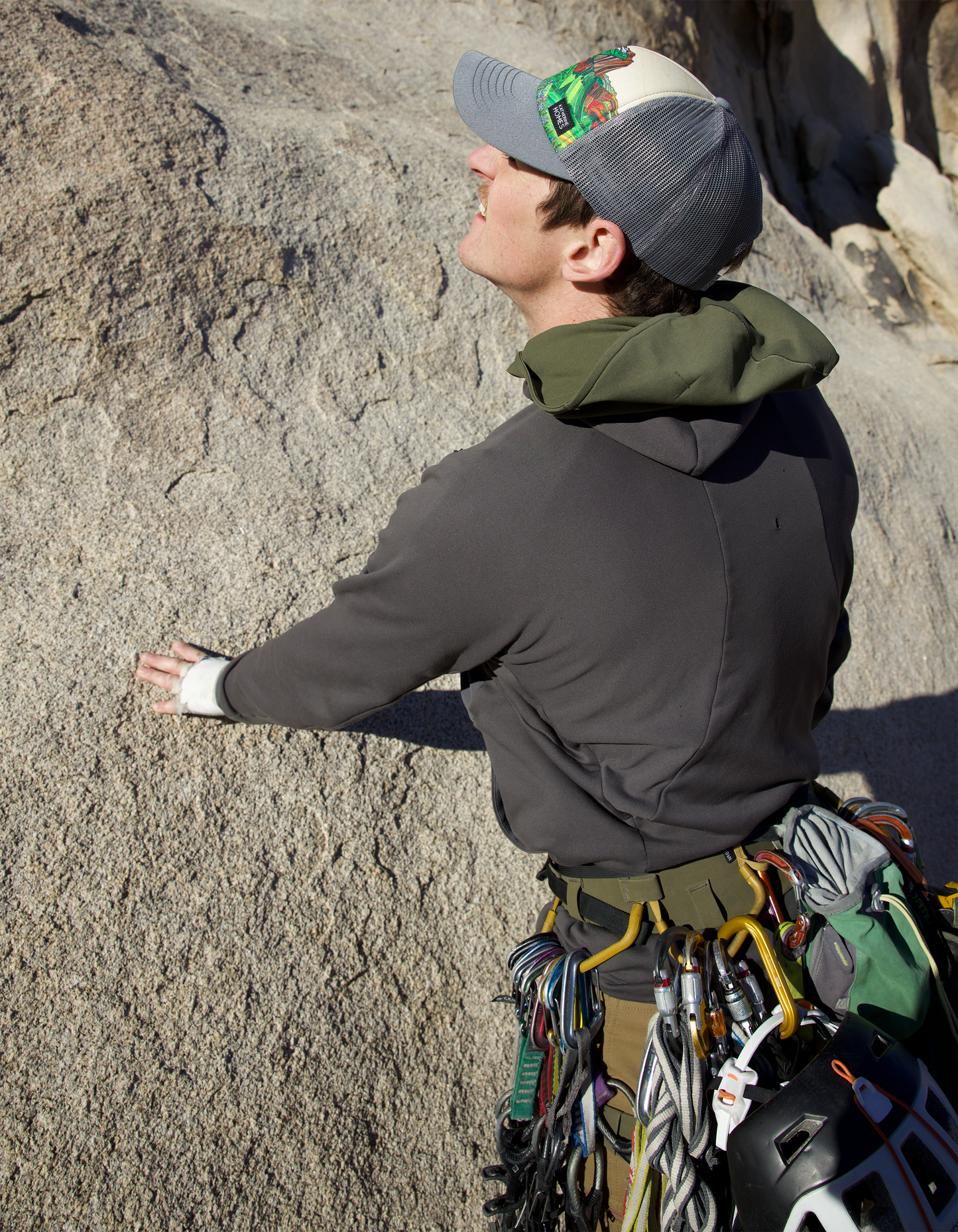 Climber wearing Glacier National Park Trucker  Hat Baseball Cap Recycled Fabrics Hat by artist  Katherine Homes, rock climbing, outdoor adventure hat