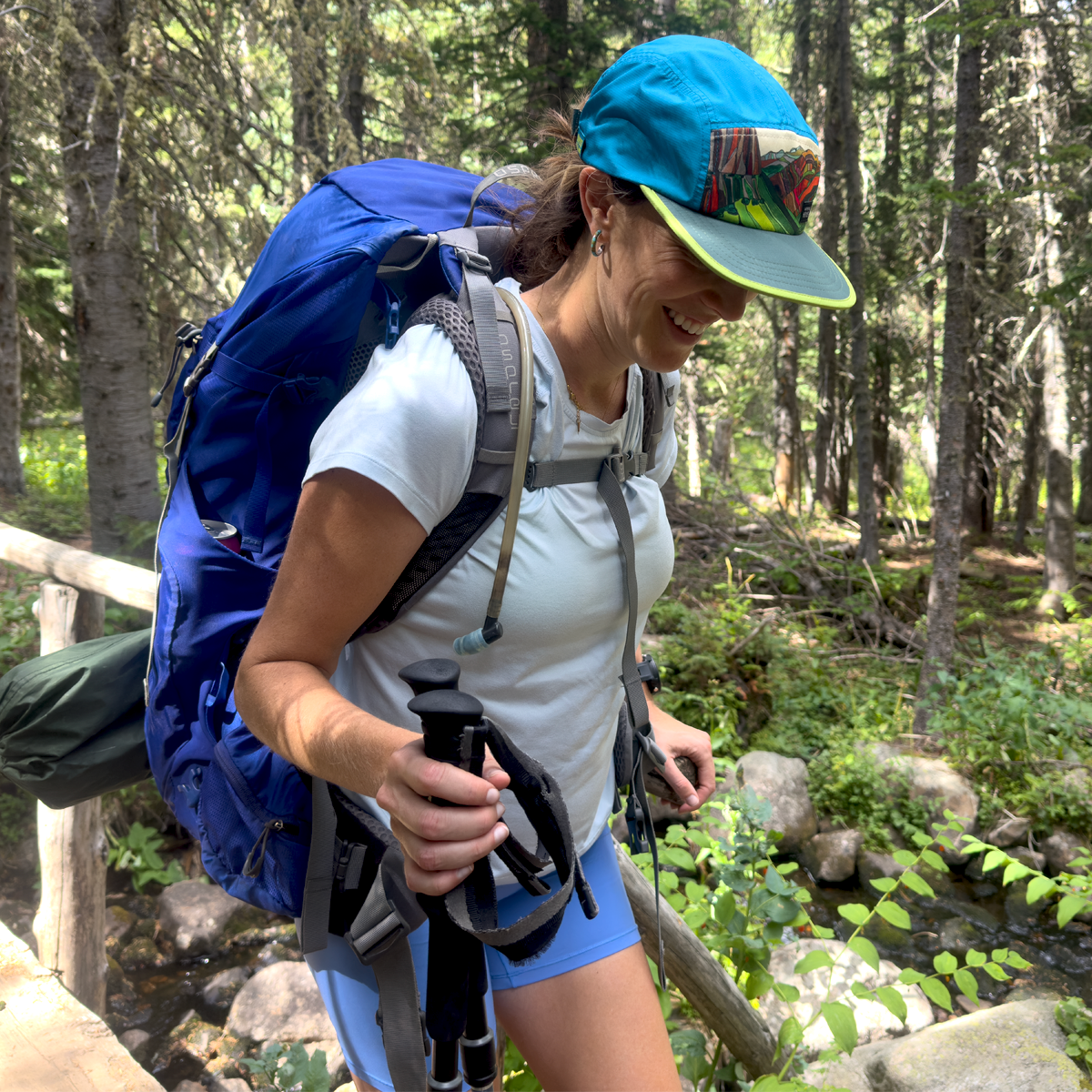 Trio of Summits Glacier National Park Running Hat | Grass, Sky, Stone | UPF 50+